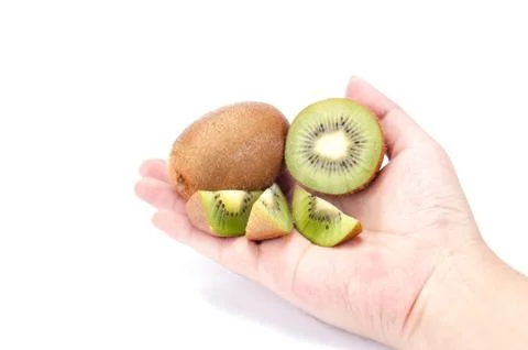 Kiwi in hand on white background Stock Photos