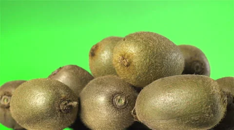 Kiwi isolated rotating on green background. Stock Footage 63349038