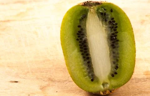 Kiwi on the kitchen table Stock Photos
