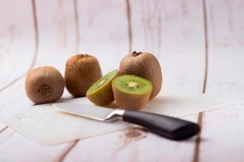 Kiwi with knife Stock Photos