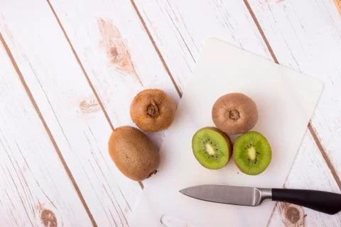 Kiwi with knife Stock Photos