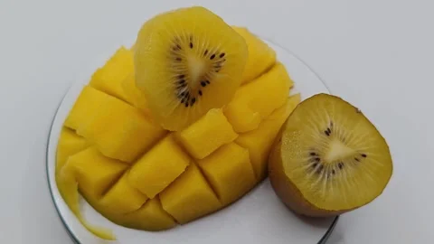 Kiwi mango dessert close-up on a light background Stock Footage 325124478
