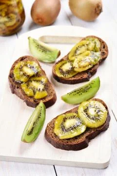 Kiwi marmalade on bread Stock Photos