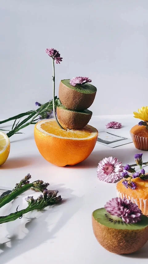 Kiwi, orange, stack, table setting, flowers, polaroids, composition, Stock Footage 267265152