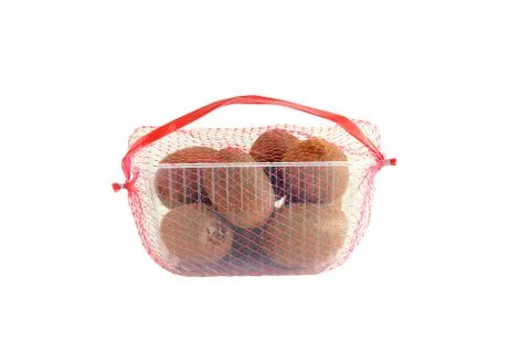 Kiwi in a plastic tray in the grid. Packaging for sale. White isolate Stock Photos