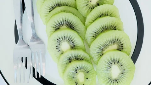 Kiwi on plate, top view Stock Footage 104069871