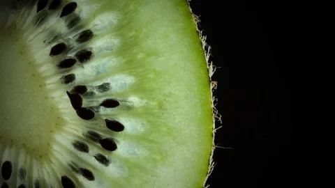 Kiwi rotation on black background - slice Stock Footage 79829283