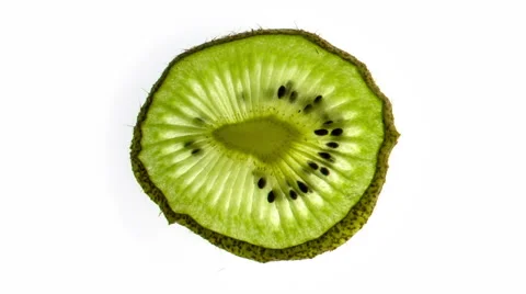 Kiwi slice  - time lapse drying out over a white back ground Stock Footage 65225083