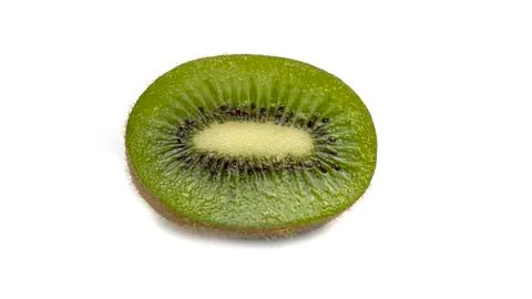 Kiwi slice on a white background. Macro photo. Stock Photos