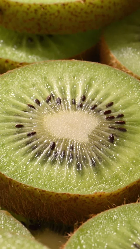 Kiwi slices 360 turntable macro loop, fresh product showcase food branding. Vidéo 332220412