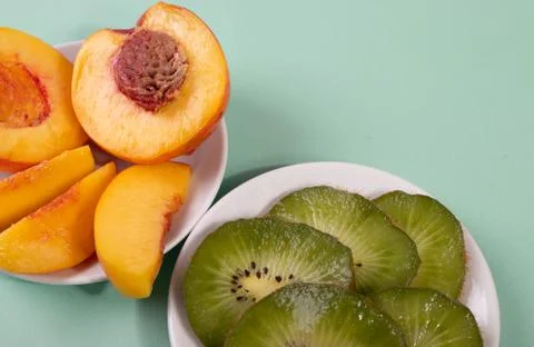 Kiwi in slices Stock Photos