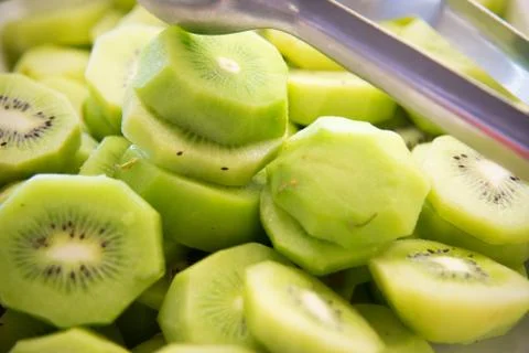 Kiwi slices texture as background . Stock Photos