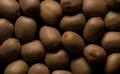 Kiwis on black background Stock Photos