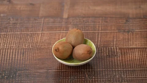 Kiwis on a plate Stock Footage 183511962