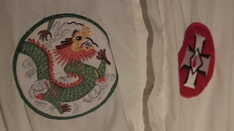 KKK Robe Cross and Dragon patch Rack Stock Footage 78951817