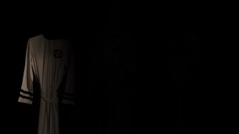 KKK Robes - light shows from left to right Stock Footage 129768608