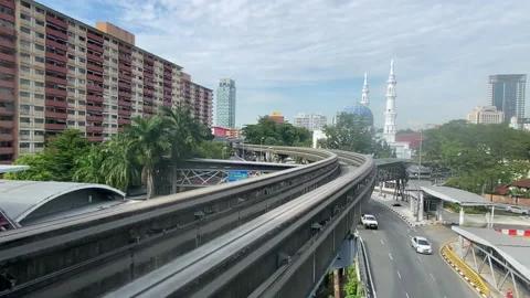 KL Monorail LRT sky Train pulling into the station  Stock Footage 182273653