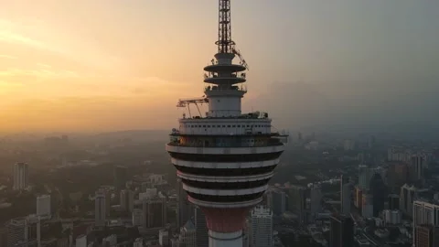 KL Tower during Sunset with Kuala Lumpur city center in the background Stock Footage 169032011