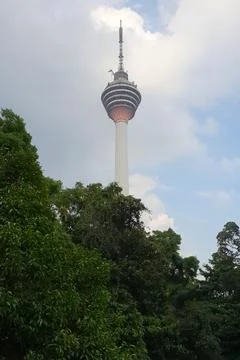 KL Tower view from below with trees in front as forground. Stock Photos