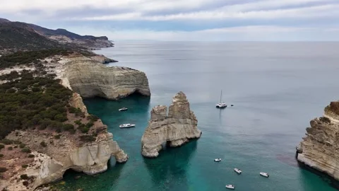 Kleftiko landmark sea stack and volcanic cliffs with boats on the Aegean Sea Stock Footage 344919287