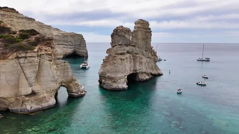 Kleftiko volcanic rock stack and sea caves rising from the Aegean Sea, Milos Stock Footage 344919454