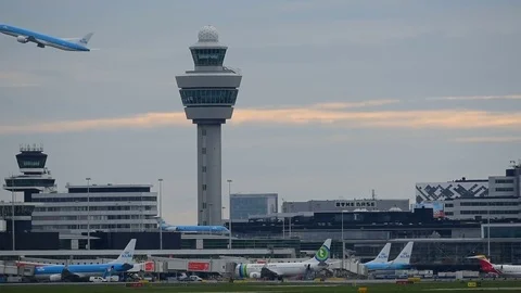 KLM airplane taking off in front of the control tower. Stock Footage 76572849