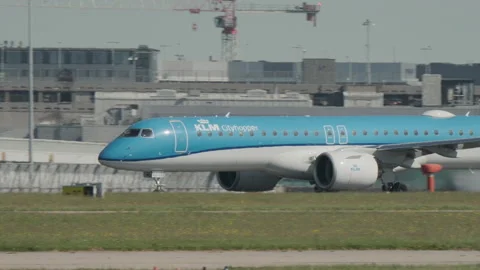 KLM Embraer E195 going down runway at Manchester Airport before takeoff Stock Footage 335645661
