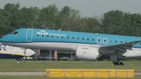 KLM Embraer E195 taking off from Manchester Airport slow motion Stock Footage 335647881