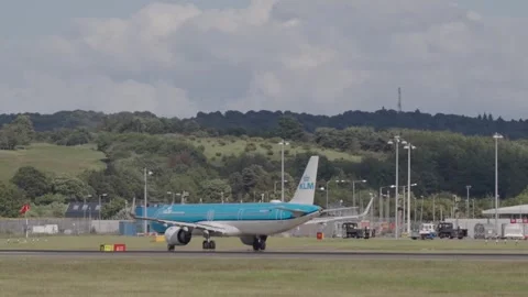 KLM plane moving on runway on a cloudy day Stock Footage 336693772