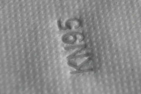 KN 95 Mask close up image of fiber and name Stock Photos