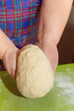 Knead the dough with your hands on the table Stock Photos