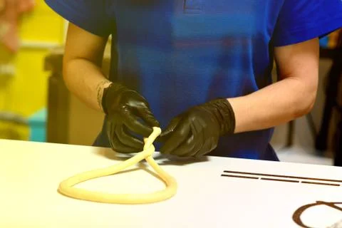 Kneading and making bread dough, female hand Stock Photos