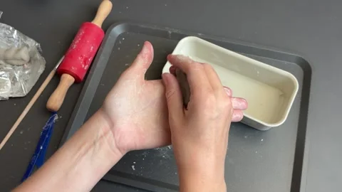 Kneading and smoothing clay for a handmade miniature pumpkin sculpture Stock Footage 345720890