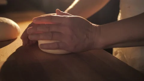 Kneading bread dough. Footage of chef making dough for donuts or pizza. Video stock 168533997