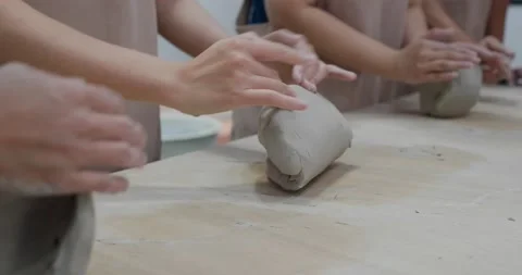 Kneading clay material before making pottery Stock Footage 138340597