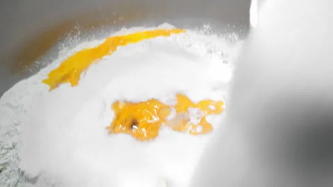 Kneading the dough. Adding sugar to the dough. Industrial production of dough. Stock Footage 242235842