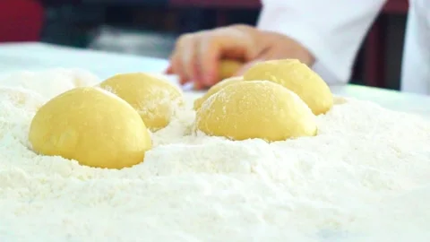 Kneading dough and throwing it into flour Stock Footage 153704000