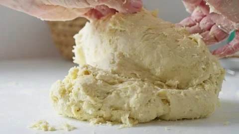 Kneading Dough for Baking A Detailed StepbyStep Process to Create Perfect Bread Stock Footage 314564031
