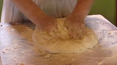 Kneading dough for a bread Stock Footage 21272271