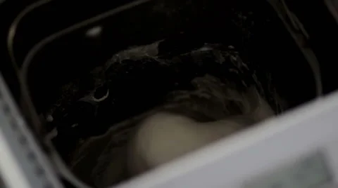 Kneading the dough in the bread machine Stock Footage 60563647