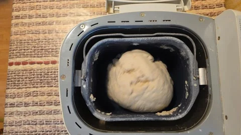 Kneading dough in bread maker with sound Stock Footage 335780934