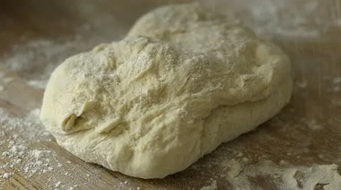 Kneading dough Stock Footage 12590866