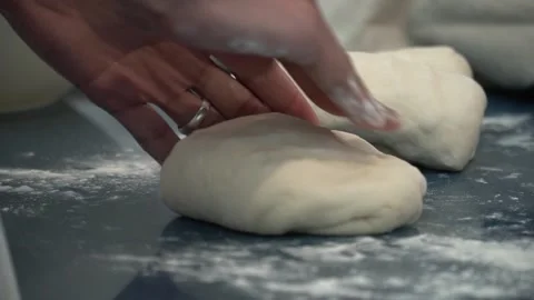 Kneading Dough in a Kitchen Stock Footage 317472599