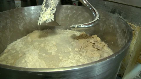 Kneading the dough in a kneading machine Stock Footage 99615292