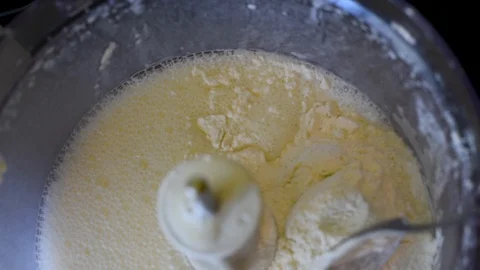 Kneading dough in a metal container for baking desserts Stock Footage 95393671