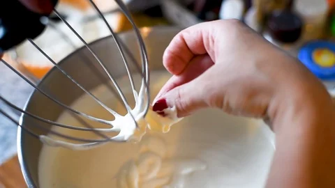 Kneading dough in a metal container for baking desserts Stock Footage 96186963