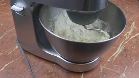 Kneading dough in the modern kitchen machine on a table Video stock 167959139
