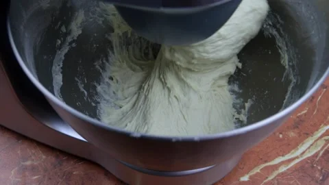 Kneading dough in the modern kitchen machine on a table Stock Footage 235587542