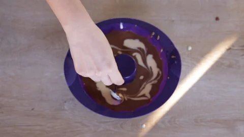 Kneading the dough. The process of making a delicious treat or chocolate dessert Stock Footage 144922218