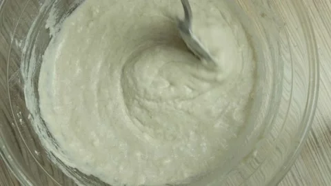 Kneading the dough. The process of making a delicious treat or dessert. Ingredie Video stock 163594048